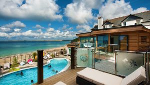 deck overlooking pool and ocean