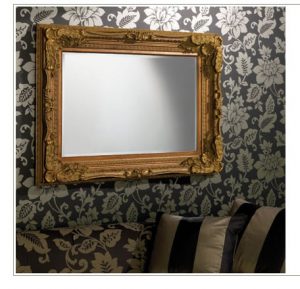 framed mirror on wallpaper