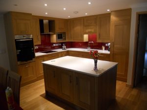 wooden kitchen and red splashback