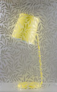 yellow lamp and leaf patterned glass