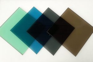four squares of tinted glass green, blue, grey, bronze
