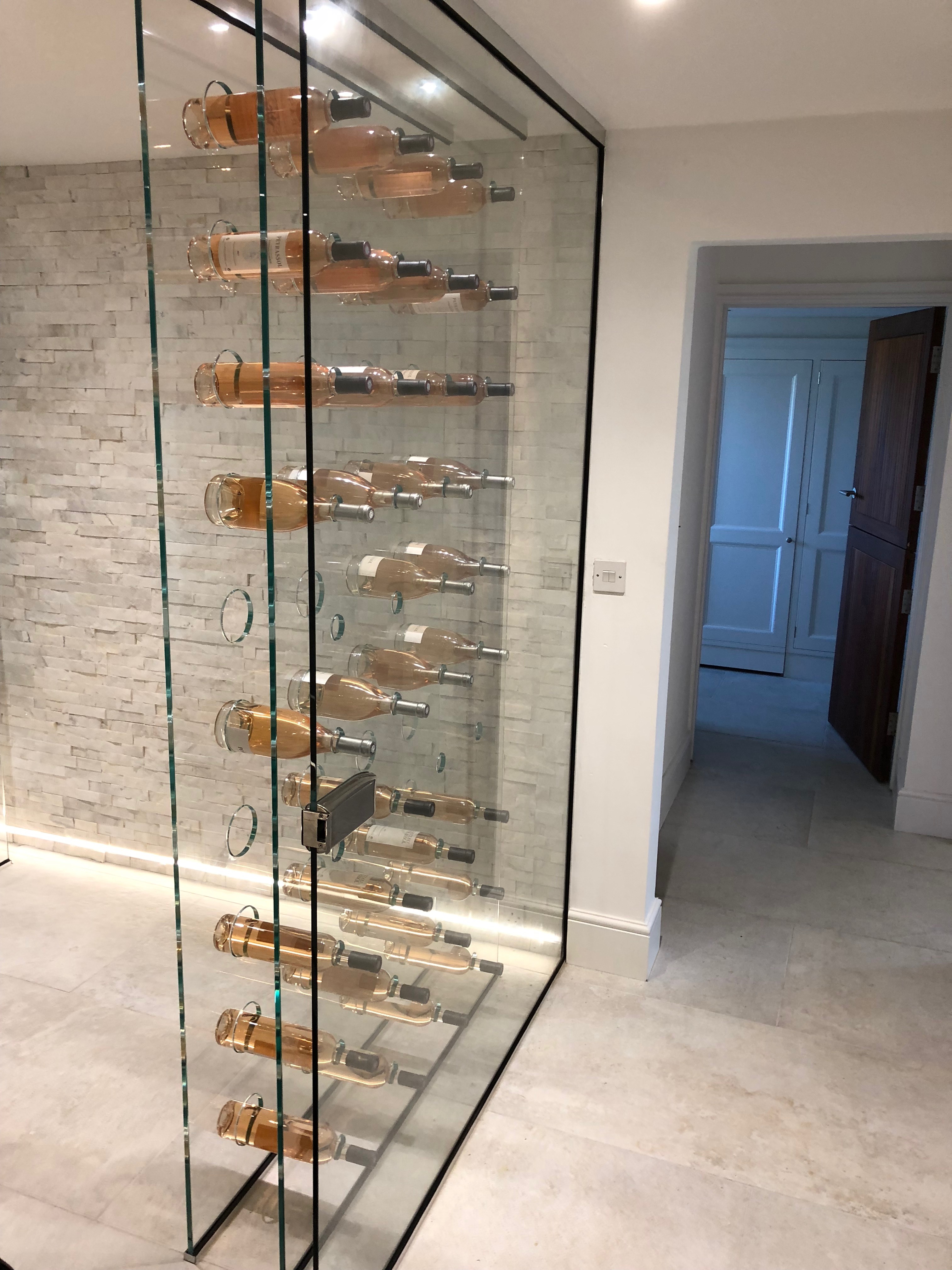 Glass and wine bottles in a room